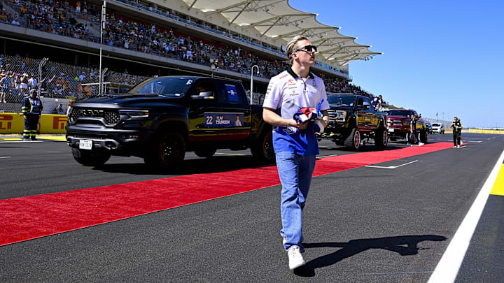Oct 20, 2024; Austin, Texas, USA; Visa Cash App RB Formula One Team driver Liam Lawson (30) of Team New Zealand walks back to the paddock after the driver’s parade before the 2024 Formula One US Grand Prix at Circuit of the Americas. Mandatory Credit: Jerome Miron-Imagn Images