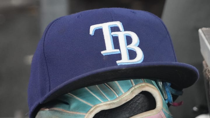 Sep 26, 2025; Toronto, Ontario, CAN; The hat and glove of Tampa Bay Rays third baseman Junior Caminero (13) in the dugout during the game against the Toronto Blue Jays at Rogers Centre. 