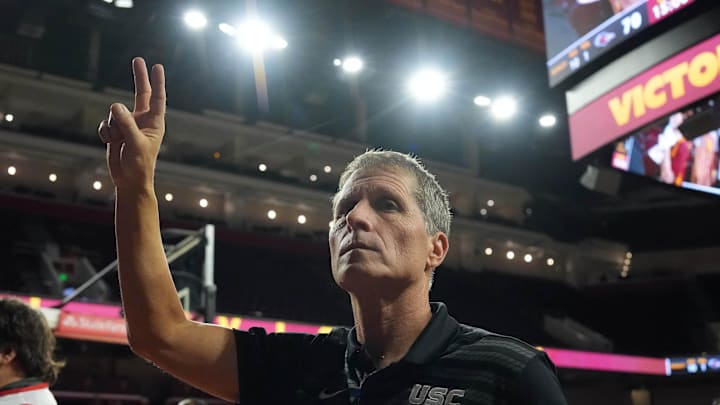 Dec 17, 2025; Los Angeles, California, USA; Southern California Trojans head coach Eric Musselman holds up Fight On sign after victory against the UTSA Roadrunners at the Galen Center. Mandatory Credit: Kirby Lee-Imagn Images