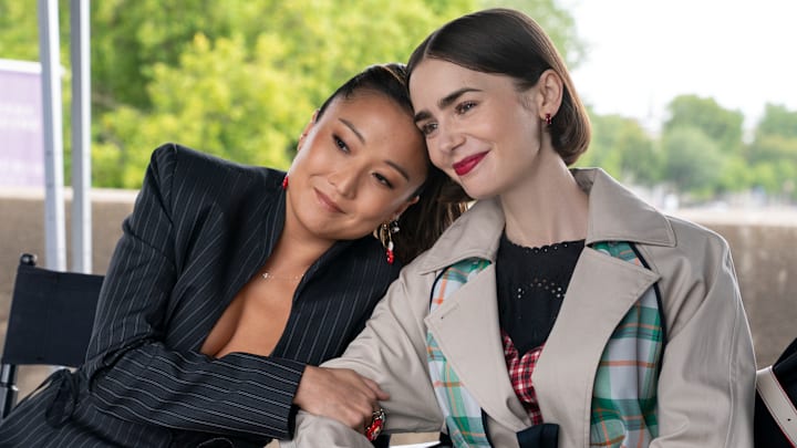 Emily In Paris. (L to R) Ashley Park as Mindy, Lily Collins as Emily in episode 506 of Emily In Paris Emily In Paris. (L to R) Ashley Park as Mindy, Lily Collins as Emily in episode 506 of Emily In Paris