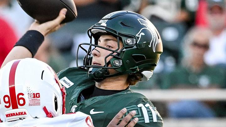 Michigan State’s Alessio Milivojevic, right, throws a pass as Nebraska’s Williams Nwaneri closes in during the first quarter on Saturday, Sept. 26, 2026, in East Lansing. Michigan State’s Alessio Milivojevic, right, throws a pass as Nebraska’s Williams Nwaneri closes in during the first quarter on Saturday, Sept. 26, 2026, in East Lansing.