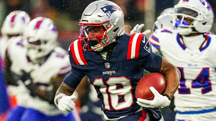 Dec 14, 2025; Foxborough, Massachusetts, USA; New England Patriots wide receiver Kyle Williams (18) runs the ball against the Buffalo Bills in the second half at Gillette Stadium. 