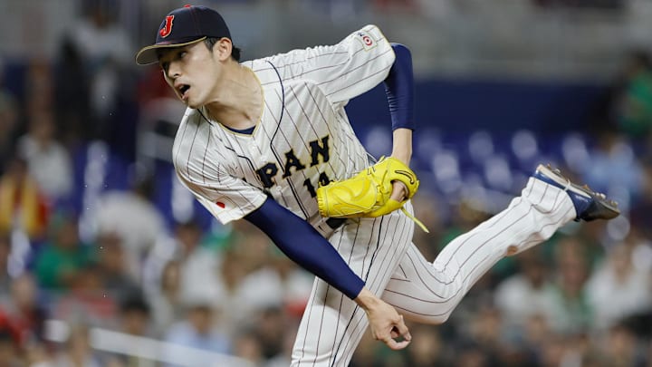 Mar 20, 2023; Miami, Florida, USA; Japan starting pitcher Roki Sasaki (14) delivers a pitch during the first inning against Mexico at LoanDepot Park
