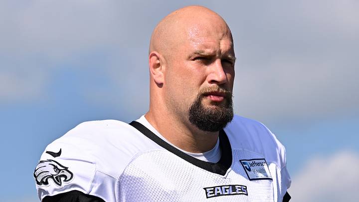 Aug 19, 2026; Foxborough, Massachusetts, USA; Philadelphia Eagles offensive tackle Lane Johnson (65) walks to the practice field during training camp at Gillette Stadium. 
