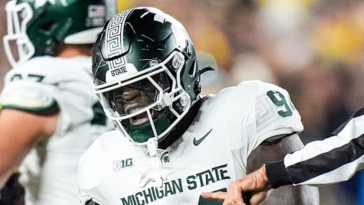 Michigan State defensive lineman D'Quan Douse (94) celebrates a tackle against Michigan during the first half at Michigan Stadium in Ann Arbor on Saturday, Oct. 26, 2024. Michigan State defensive lineman D'Quan Douse (94) celebrates a tackle against Michigan during the first half at Michigan Stadium in Ann Arbor on Saturday, Oct. 26, 2024.