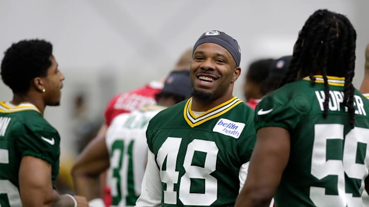 Green Bay Packers linebacker Jamon Johnson (48) talks with teammate linebacker Ty'Ron Hopper (59) during the team's first day of minicamp on June 10, 2025, at Ray Nitschke Field in Ashwaubenon, Wis.