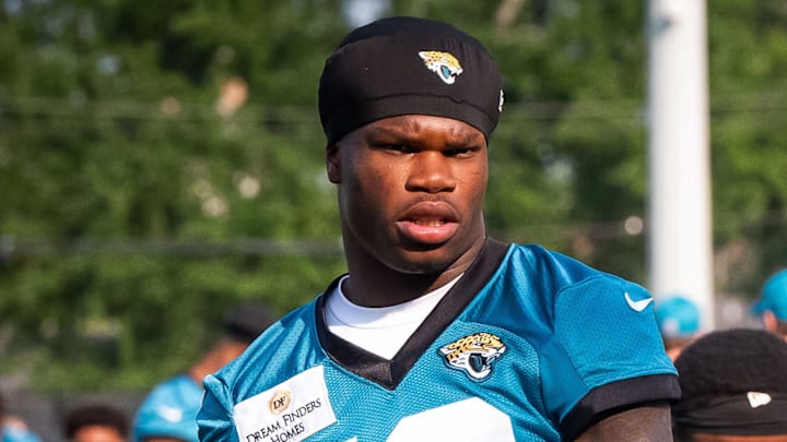 Jacksonville Jaguars wide receiver Travis Hunter (12) stretches during the seventh organized team activity at the Miller Electric Center in Jacksonville, Fla. Monday, June 2, 2025. [Doug Engle/Florida Times-Union]