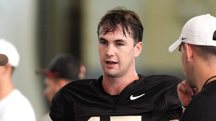 Oklahoma State's quarterback Drew Mestemaker talks with coaches during an Oklahoma State football practice in Stillwater, Okla., Aug. 18, 2026