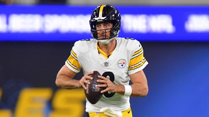 Nov 9, 2025; Inglewood, California, USA; Pittsburgh Steelers quarterback Aaron Rodgers (8) scrambles with the ball against the Los Angeles Chargers during the first quarter of the game at SoFi Stadium. Mandatory Credit: Gary A. Vasquez-Imagn Images