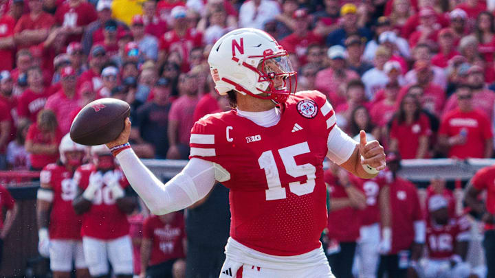 Sep 20, 2025; Lincoln, Nebraska, USA; Nebraska Cornhuskers quarterback Dylan Raiola (15) throws a touchdown pass against the Michigan Wolverines during the second quarter at Memorial Stadium. Mandatory Credit: Dylan Widger-Imagn Images