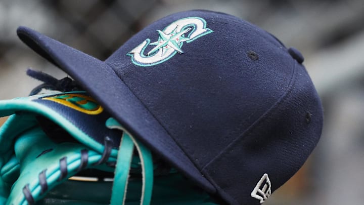 May 12, 2018; Detroit, MI, USA; Hat and glove of Seattle Mariners center fielder Dee Gordon (9) sits in dugout during the third inning against the Detroit Tigers at Comerica Park. 