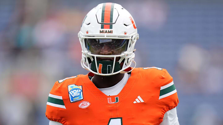 Dec 28, 2024; Orlando, FL, USA; Miami Hurricanes quarterback Cam Ward (1) warms up prior to the game against the Iowa State Cyclones at Camping World Stadium. Mandatory Credit: Jasen Vinlove-Imagn Images