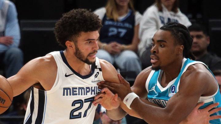Oct 16, 2026; Memphis, Tennessee, USA; Memphis Grizzlies forward Cameron Boozer (27) drives to the basket as Charlotte Hornets forward Micheal Ajayi (10) defends during the fourth quarter at FedExForum. Mandatory Credit: Petre Thomas-Imagn Images Oct 16, 2026; Memphis, Tennessee, USA; Memphis Grizzlies forward Cameron Boozer (27) drives to the basket as Charlotte Hornets forward Micheal Ajayi (10) defends during the fourth quarter at FedExForum. Mandatory Credit: Petre Thomas-Imagn Images