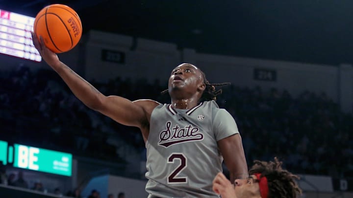 Mississippi State Bulldogs guard Ja’Borri McGhee (2) drives to the basket as Alabama Crimson Tide forward Amari Allen (5) defends during the first half at Humphrey Coliseum.