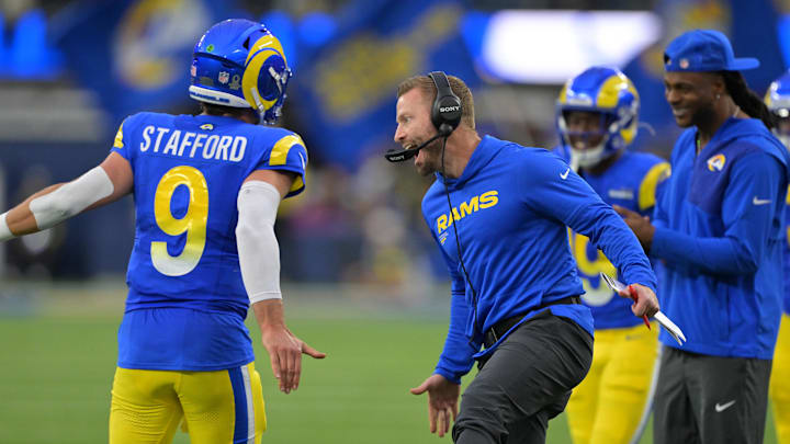 Jan 4, 2026; Inglewood, California, USA;  Los Angeles Rams head coach Sean McVay reacts with quarterback Matthew Stafford (9) after a touchdown against the Arizona Cardinals during the second half at SoFi Stadium. Mandatory Credit: Jayne Kamin-Oncea-Imagn Images