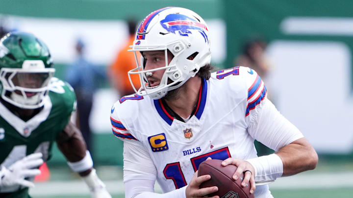 Sep 14, 2025; East Rutherford, New Jersey, USA; Buffalo Bills quarterback Josh Allen (17) rushes the ball past New York Jets linebacker Marcelino McCrary-Ball (41) during the first half at MetLife Stadium. Sep 14, 2025; East Rutherford, New Jersey, USA; Buffalo Bills quarterback Josh Allen (17) rushes the ball past New York Jets linebacker Marcelino McCrary-Ball (41) during the first half at MetLife Stadium.