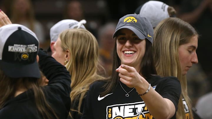 Iowa’s Caitlin Clark points to the crowd during a celebration of the Iowa women’s basketball team.