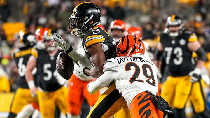 Cincinnati Bengals cornerback Cam Taylor-Britt breaks up a pass to Pittsburgh Steelers wide receiver George Pickens. Cincinnati Bengals cornerback Cam Taylor-Britt breaks up a pass to Pittsburgh Steelers wide receiver George Pickens.