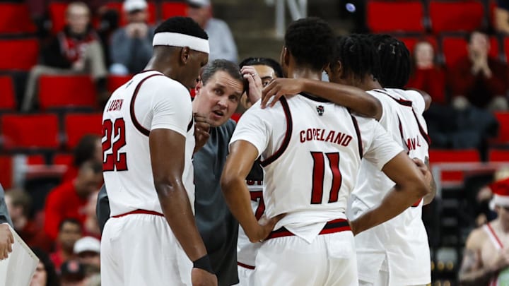Dec 6, 2025; Raleigh, North Carolina, USA; NC State Wolfpack huddle with head coach Will Wade during the second half of the game against UNC Asheville Bulldogs at Lenovo Center. Mandatory Credit: Jaylynn Nash-Imagn Images