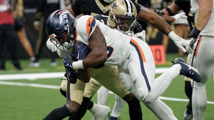 Aug 23, 2025; New Orleans, Louisiana, USA; Denver Broncos running back Audric Estime (23) scores a touchdown against New Orleans Saints cornerback Rejzohn Wright (25) during the second half at Caesars Superdome. Aug 23, 2025; New Orleans, Louisiana, USA; Denver Broncos running back Audric Estime (23) scores a touchdown against New Orleans Saints cornerback Rejzohn Wright (25) during the second half at Caesars Superdome.