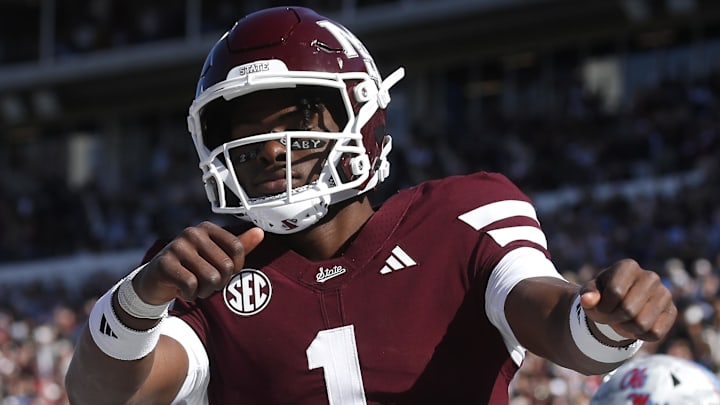 Mississippi State Bulldogs quarterback Kamario Taylor (1) celebrates after scoring a touchdown against the Ole Miss Rebels in the first half at Davis Wade Stadium at Scott Field.