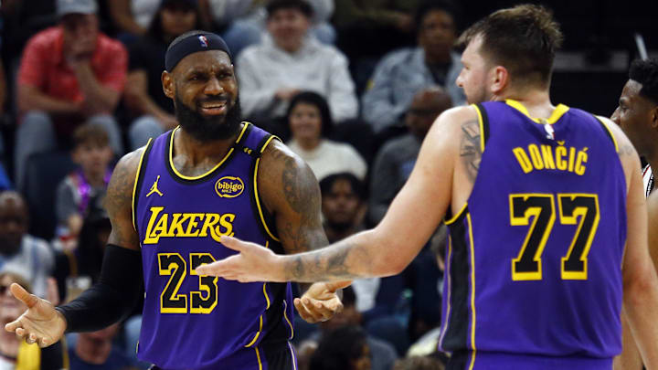 Mar 29, 2025; Memphis, Tennessee, USA; Los Angeles Lakers forward LeBron James (23) and guard Luka Doncic (77) react during the third quarter against the Memphis Grizzlies at FedExForum. Mandatory Credit: Petre Thomas-Imagn Images Mar 29, 2025; Memphis, Tennessee, USA; Los Angeles Lakers forward LeBron James (23) and guard Luka Doncic (77) react during the third quarter against the Memphis Grizzlies at FedExForum. Mandatory Credit: Petre Thomas-Imagn Images