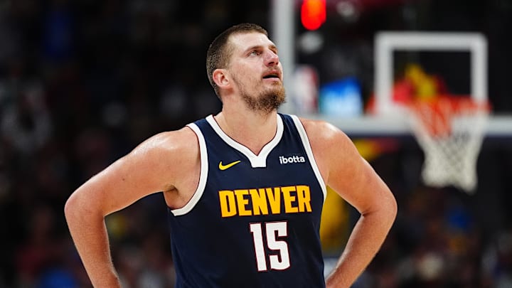 Nov 10, 2024; Denver, Colorado, USA; Denver Nuggets center Nikola Jokic (15) reacts in the second half against the Dallas Mavericks at Ball Arena. Mandatory Credit: Ron Chenoy-Imagn Images