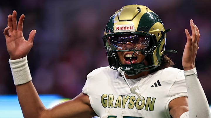 Senior quarterback Travis Burgess, a UNC commit, accounted for four touchdowns in the rain on Friday as No. 1 Grayson dismantled No. 7 Collins Hill 51-3 in a Georgia high school season opener. Senior quarterback Travis Burgess, a UNC commit, accounted for four touchdowns in the rain on Friday as No. 1 Grayson dismantled No. 7 Collins Hill 51-3 in a Georgia high school season opener.