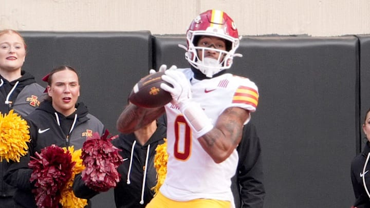 Iowa State's Chase Sowell (0) scores a touchdown as Oklahoma State's Eric Fletcher (13) defends in the first half of the college football game between the Oklahoma State Cowboys and the Iowa State Cyclones at Boone Pickens Stadium in Stillwater, Okla., Saturday Nov. 29, 2025.