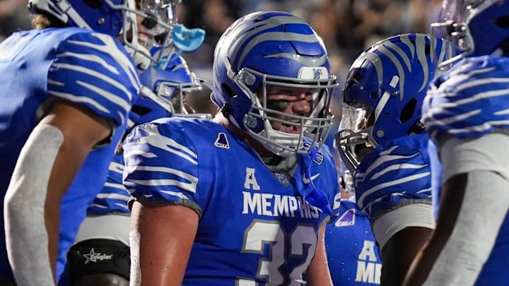 Memphis' Matt Adcock (32) celebrates with teammates after scoring a touchdown during the game between Tulsa and Memphis at Simmons Bank Liberty Stadium in Memphis, Tenn. Memphis' Matt Adcock (32) celebrates with teammates after scoring a touchdown during the game between Tulsa and Memphis at Simmons Bank Liberty Stadium in Memphis, Tenn.