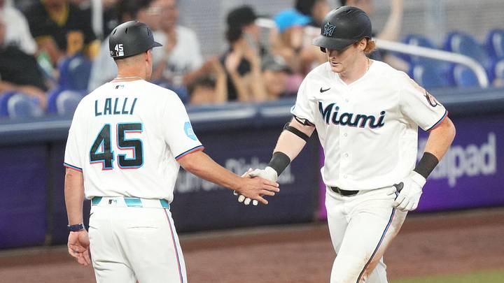 Miami Marlins third-base coach Blake Lalli (45) congratulates Miami Marlins right fielder Owen Caissie (17) on his solo home run. Miami Marlins third-base coach Blake Lalli (45) congratulates Miami Marlins right fielder Owen Caissie (17) on his solo home run.