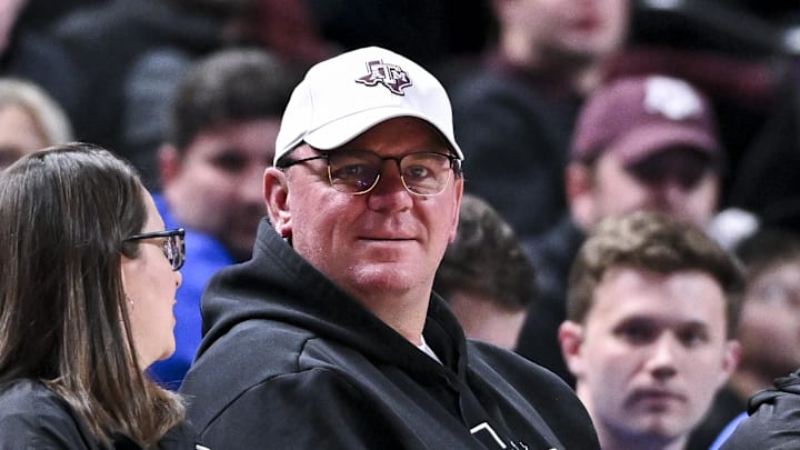 Texas A&M Aggies head football coach Mike Elko sits courtside during the Men’s basketball game against the Florida Gators