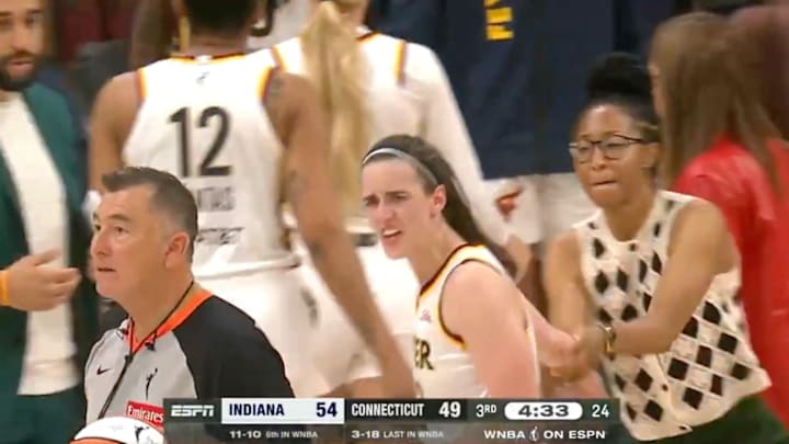Caitlin Clark had to be held back by a coach during the Fever’s game against the Sun.