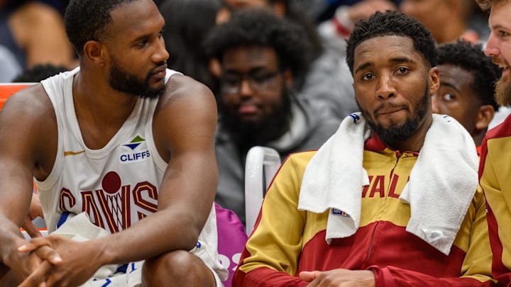 Oct 26, 2024; Washington, District of Columbia, USA; Cleveland Cavaliers guard Donovan Mitchell (45) reacts on the bench with forward Evan Mobley (4) during the fourth quarter against the Washington Wizardsat Capital One Arena. Mandatory Credit: Reggie Hildred-Imagn Images