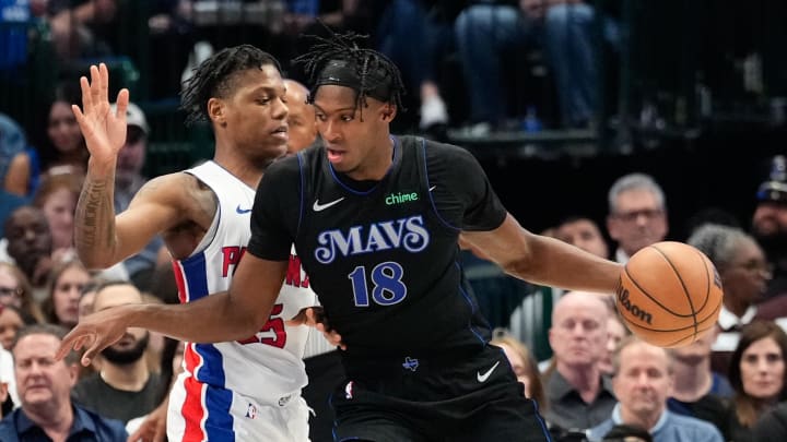 Apr 12, 2024; Dallas, Texas, USA; Dallas Mavericks forward Olivier-Maxence Prosper (18) controls the ball as Detroit Pistons guard Marcus Sasser (25) defends during the second half at American Airlines Center. Mandatory Credit: Chris Jones-USA TODAY Sports