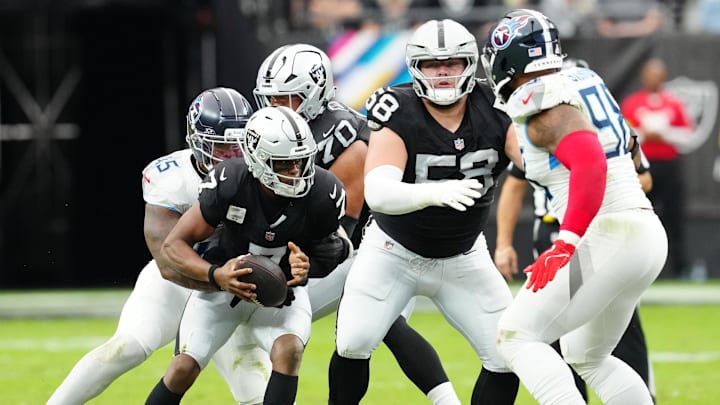 Oct 12, 2025; Paradise, Nevada, USA; Las Vegas Raiders quarterback Geno Smith (7) runs the ball during the second half against the Tennessee Titans at Allegiant Stadium. Mandatory Credit: Stephen R. Sylvanie-Imagn Images