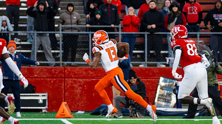 Illinois receiver Pat Bryant (13) dashes for a 40-yard touchdown reception against Rutgers at SHI Stadium in Piscataway, New Jersey, to give the Illini the game-winning score in Saturday's 38-31 victory.