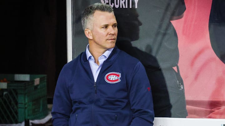 Mar 3, 2022; Calgary, Alberta, CAN; Montreal Canadiens head coach Martin St-Louis on his bench during the warmup period against the Calgary Flames at Scotiabank Saddledome. Mandatory Credit: Sergei Belski-Imagn Images