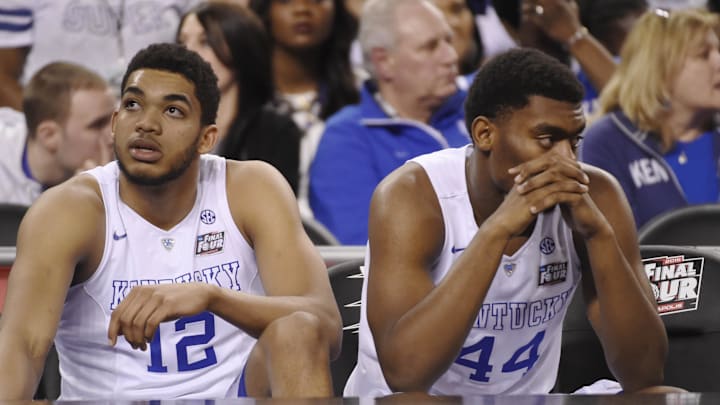 Apr 4, 2015; Indianapolis, IN, USA; Kentucky Wildcats forward Karl-Anthony Towns (12) and Dakari Johnson (44) sit on the bench following their loss to the Wisconsin Badgers 71-64 in the 2015 NCAA Men's Division I Championship semi-final game at Lucas Oil Stadium. Mandatory Credit: Robert Deutsch-Imagn Images