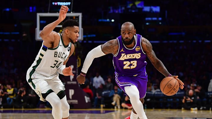Jan 9, 2026; Los Angeles, California, USA; Los Angeles Lakers forward LeBron James (23) moves the ball against Milwaukee Bucks forward Giannis Antetokounmpo (34). Mandatory Credit: Gary A. Vasquez-Imagn Images