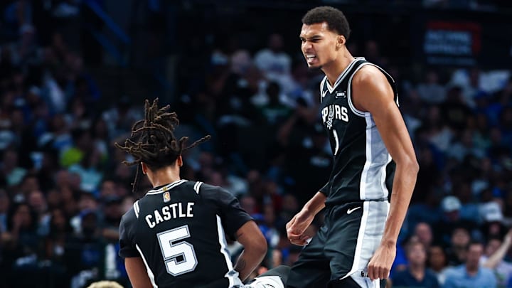 Oct 22, 2025; Dallas, Texas, USA; San Antonio Spurs forward Victor Wembanyama (1) celebrates with guard Stephon Castle (5) during the first half against the Dallas Mavericks at American Airlines Center. Oct 22, 2025; Dallas, Texas, USA; San Antonio Spurs forward Victor Wembanyama (1) celebrates with guard Stephon Castle (5) during the first half against the Dallas Mavericks at American Airlines Center.
