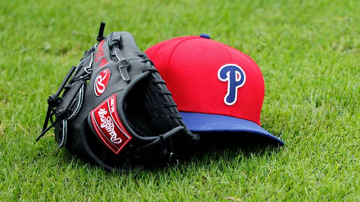 Feb 12, 2014; Clearwater, FL, USA; A general view of a Philadelphia Phillies hat and glove on the grass at Bright House Networks Field. Feb 12, 2014; Clearwater, FL, USA; A general view of a Philadelphia Phillies hat and glove on the grass at Bright House Networks Field.