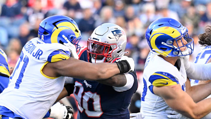 Nov 17, 2024; Foxborough, Massachusetts, USA;  New England Patriots defensive tackle Christian Barmore (90) blocks Los Angeles Rams offensive tackle Warren McClendon Jr. (71) during the first half at Gillette Stadium. Mandatory Credit: Eric Canha-Imagn Images