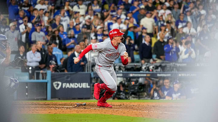 Cincinnati Reds right fielder Austin Hays (12) runs for first as he grounds out for the final out of the ninth inning of the MLB National League Wild Card Game 2 between the Los Angeles Dodgers and the Cincinnati Reds at Dodger Stadium in Los Angeles on Wednesday, Oct. 1, 2025. The Reds were eliminated from the postseason with an 8-4 loss to the reining World Series Champions La Dodgers.