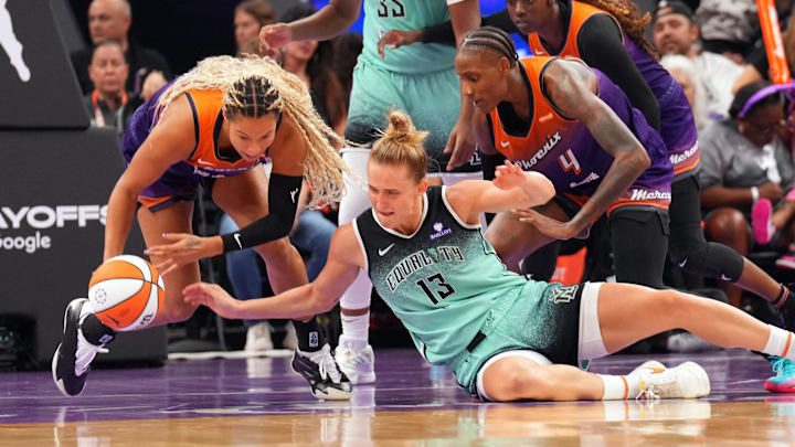 Sep 19, 2025; Phoenix, Arizona, USA; Phoenix Mercury forward Satou Sabally (0) and New York Liberty forward Leonie Fiebich (13) go after a loose ball during the second half of game three of round one for the 2025 WNBA Playoffs at PHX Arena. Mandatory Credit: Joe Camporeale-Imagn Images Sep 19, 2025; Phoenix, Arizona, USA; Phoenix Mercury forward Satou Sabally (0) and New York Liberty forward Leonie Fiebich (13) go after a loose ball during the second half of game three of round one for the 2025 WNBA Playoffs at PHX Arena. Mandatory Credit: Joe Camporeale-Imagn Images