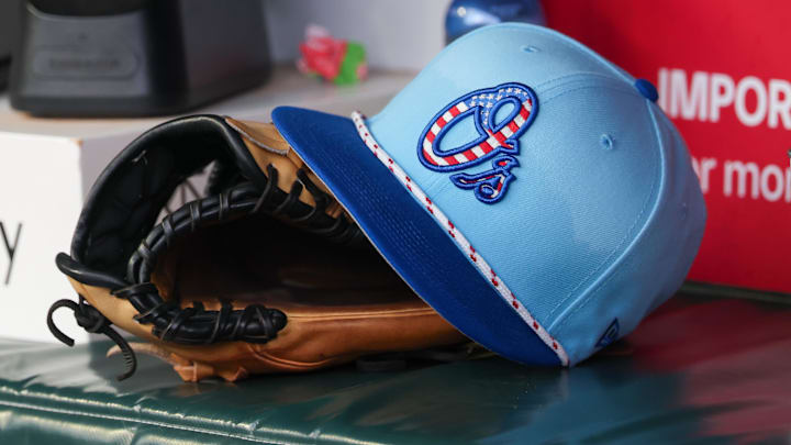 Jul 4, 2025; Atlanta, Georgia, USA; A detailed view of the Baltimore Orioles 4th of July hat in the dugout against the Atlanta Braves in the third inning at Truist Park. Jul 4, 2025; Atlanta, Georgia, USA; A detailed view of the Baltimore Orioles 4th of July hat in the dugout against the Atlanta Braves in the third inning at Truist Park.