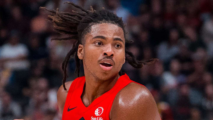 Oct 6, 2025; Vancouver, British Columbia, CAN; Toronto Raptors forward Collin Murray-Boyles (12) handles the ball against the Denver Nuggets in the second half at Rogers Arena. Mandatory Credit: Bob Frid-Imagn Images