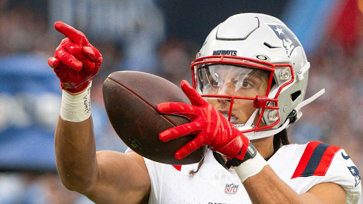 Oct 19, 2025; Nashville, Tennessee, USA;  New England Patriots wide receiver Mack Hollins (13) points after making the first down against the Tennessee Titans during the first half at Nissan Stadium. Mandatory Credit: Steve Roberts-Imagn Images
