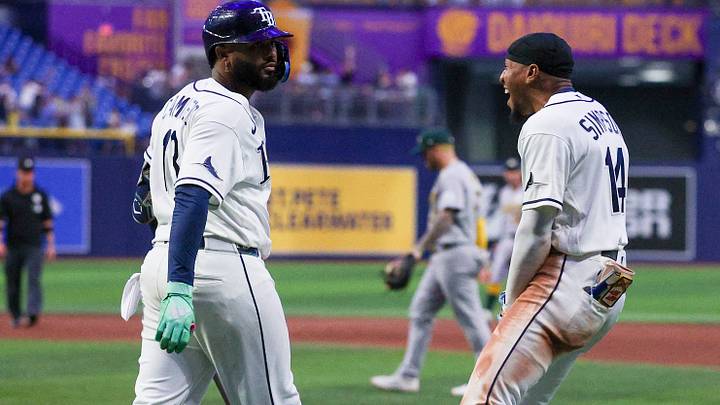 Sep 15, 2026; St. Petersburg, Florida, USA; Tampa Bay Rays third baseman Junior Caminero (13) react with left fielder Chandler Simpson (14) after hitting a walk off home run against the Oakland Athletics in the ninth inning at Tropicana Field. Mandatory Credit: Nathan Ray Seebeck-Imagn Images Sep 15, 2026; St. Petersburg, Florida, USA; Tampa Bay Rays third baseman Junior Caminero (13) react with left fielder Chandler Simpson (14) after hitting a walk off home run against the Oakland Athletics in the ninth inning at Tropicana Field. Mandatory Credit: Nathan Ray Seebeck-Imagn Images