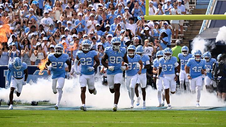 Sep 13, 2025; Chapel Hill, North Carolina, USA; North Carolina Tar Heels run on to the field before the game at Kenan Stadium. Mandatory Credit: Bob Donnan-Imagn Images Sep 13, 2025; Chapel Hill, North Carolina, USA; North Carolina Tar Heels run on to the field before the game at Kenan Stadium. Mandatory Credit: Bob Donnan-Imagn Images